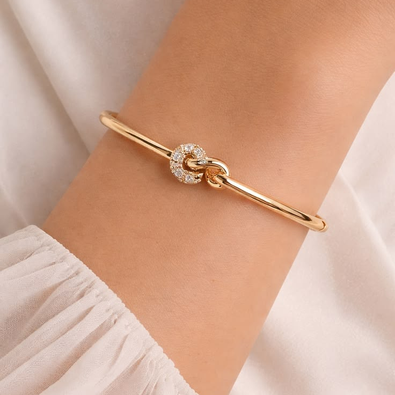 Elegant Gold-Tone Knotted Crystal Bangle